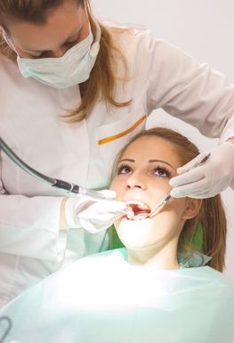 A woman undergoing dental treatment