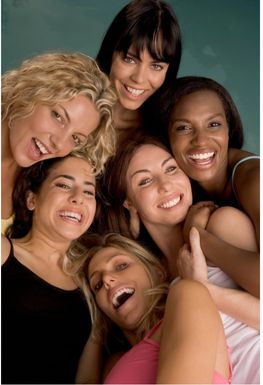 A group of six women smiling