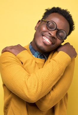 A man hugging himself