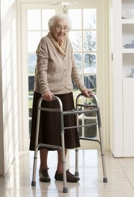 Elderly woman with a walking frame