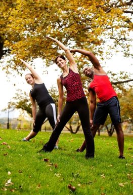 A group of people exercising outdoors
